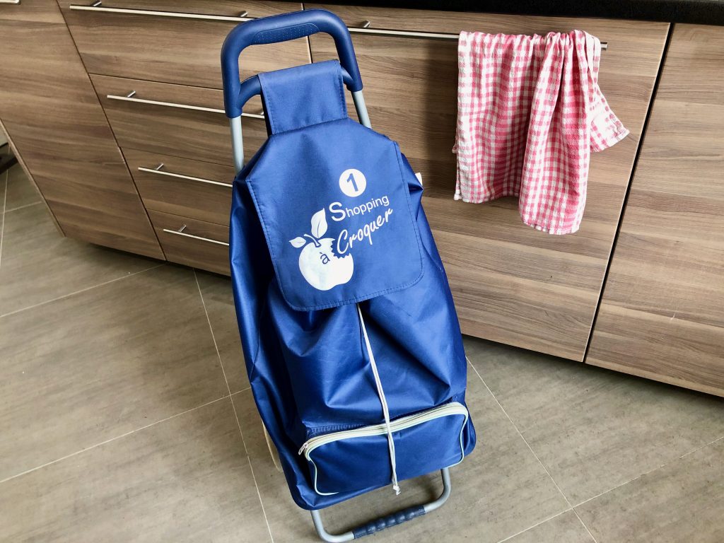 blue rolling shopping caddy