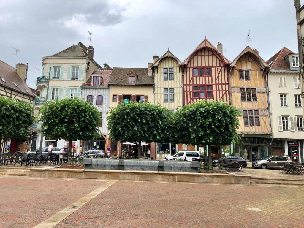 a row of half-timbered and colorful houses in Troyes, France