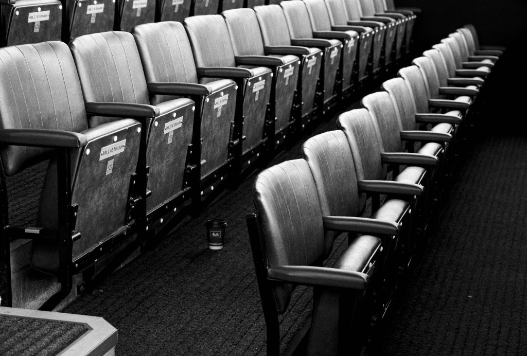 two rows of fold up chairs for jury duty