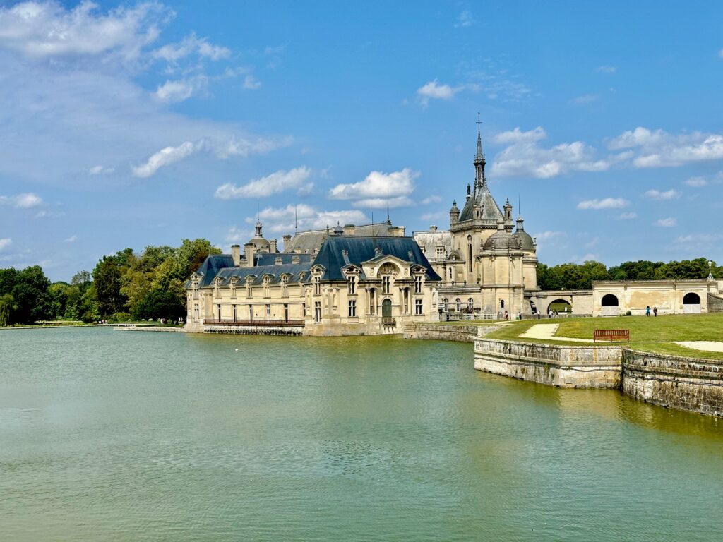 Château de Chantilly from a distance with blue skies