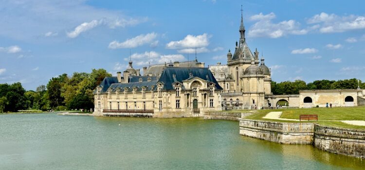 Château de Chantilly from a distance with blue skies